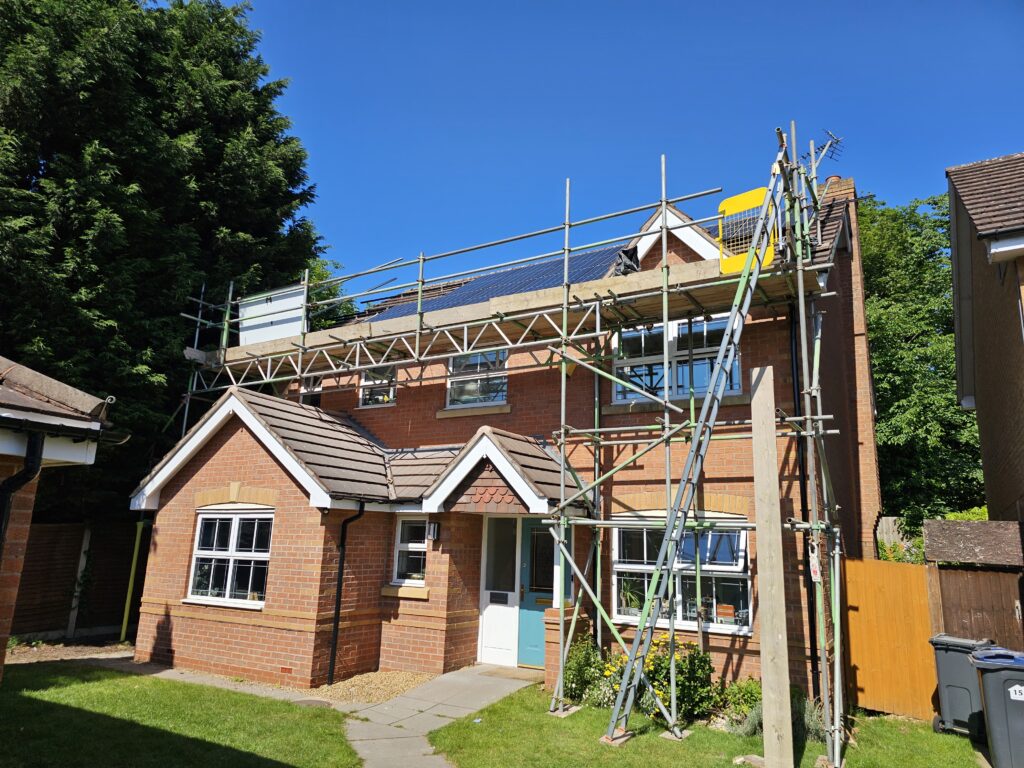 Solar panels on a roof with scaffolding access